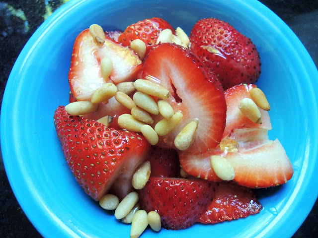 Strawberries with toasted pine nuts and honey