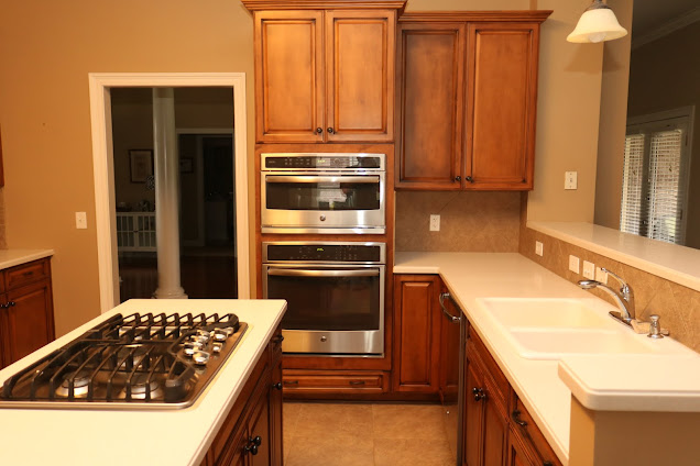 Kitchen with doorways to Dining and Great Rooms & new GE appliances including 5-burner gas cooktop