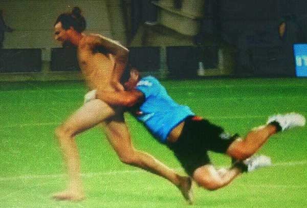 Rugby coach tackled half time streaker 