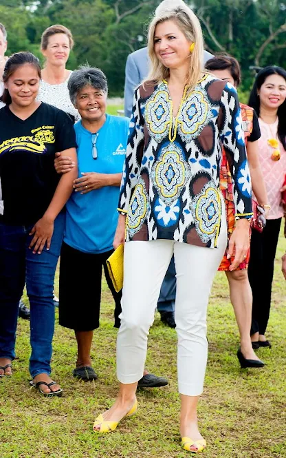 Filipino pineapple growers, during her visit at a Pineapple farm in Tagaytay City, south of Manila, Philippines