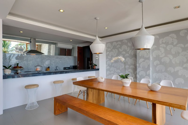 Picture of wooden dining table and benches in the dining room