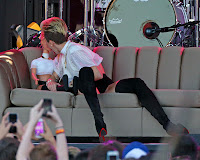 Miley Cyrus kissing a doll