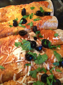 Baked and garnished with parsley and black olives, the Light & Easy Enchiladas are ready to serve.. 
