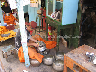 a man working on a metal bowl