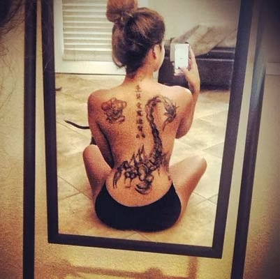 tattoo de escorpião feminino nas costas grande