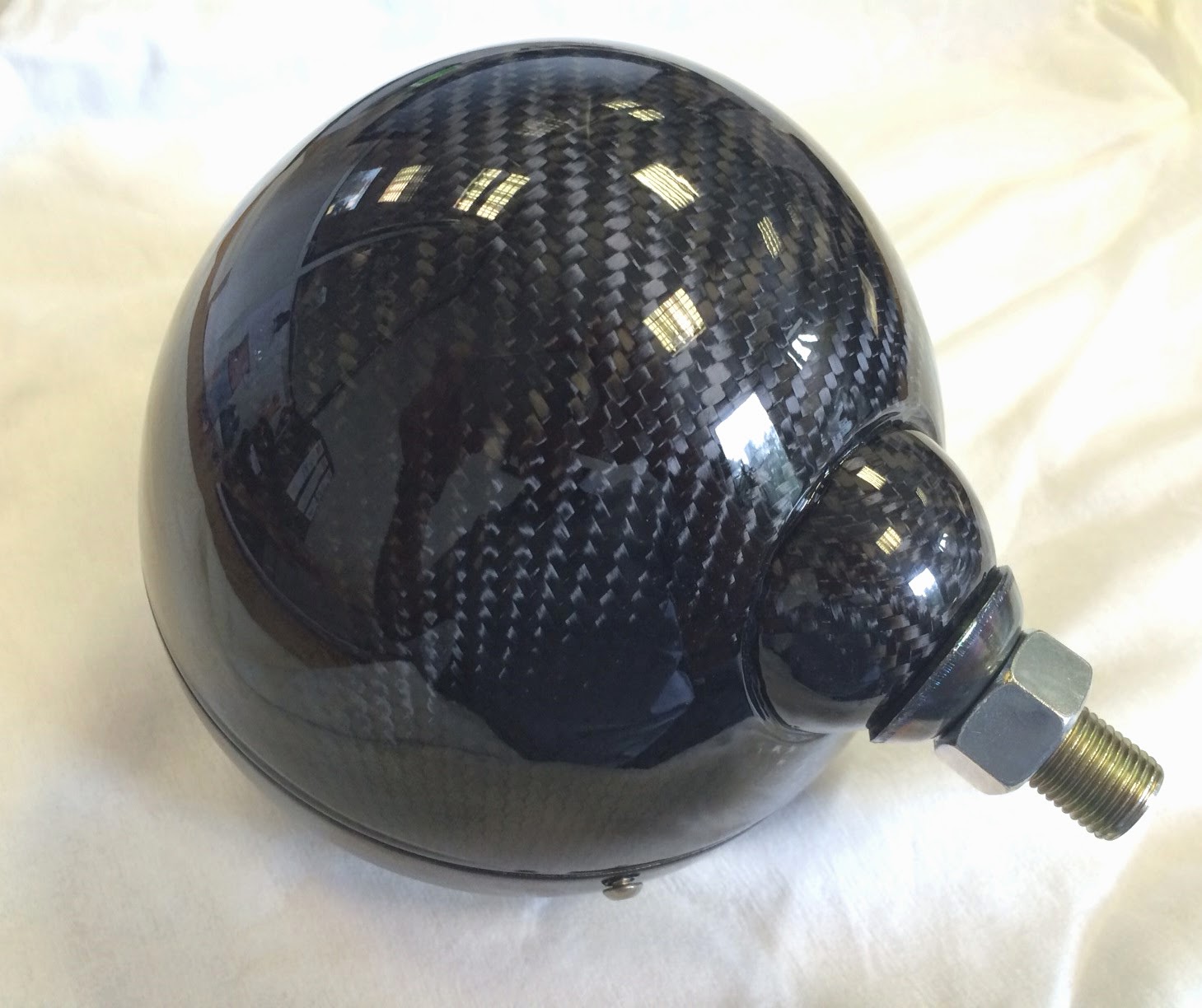 Caterham carbon fibre headlight bowls, freshly lacquered and looking amazing.