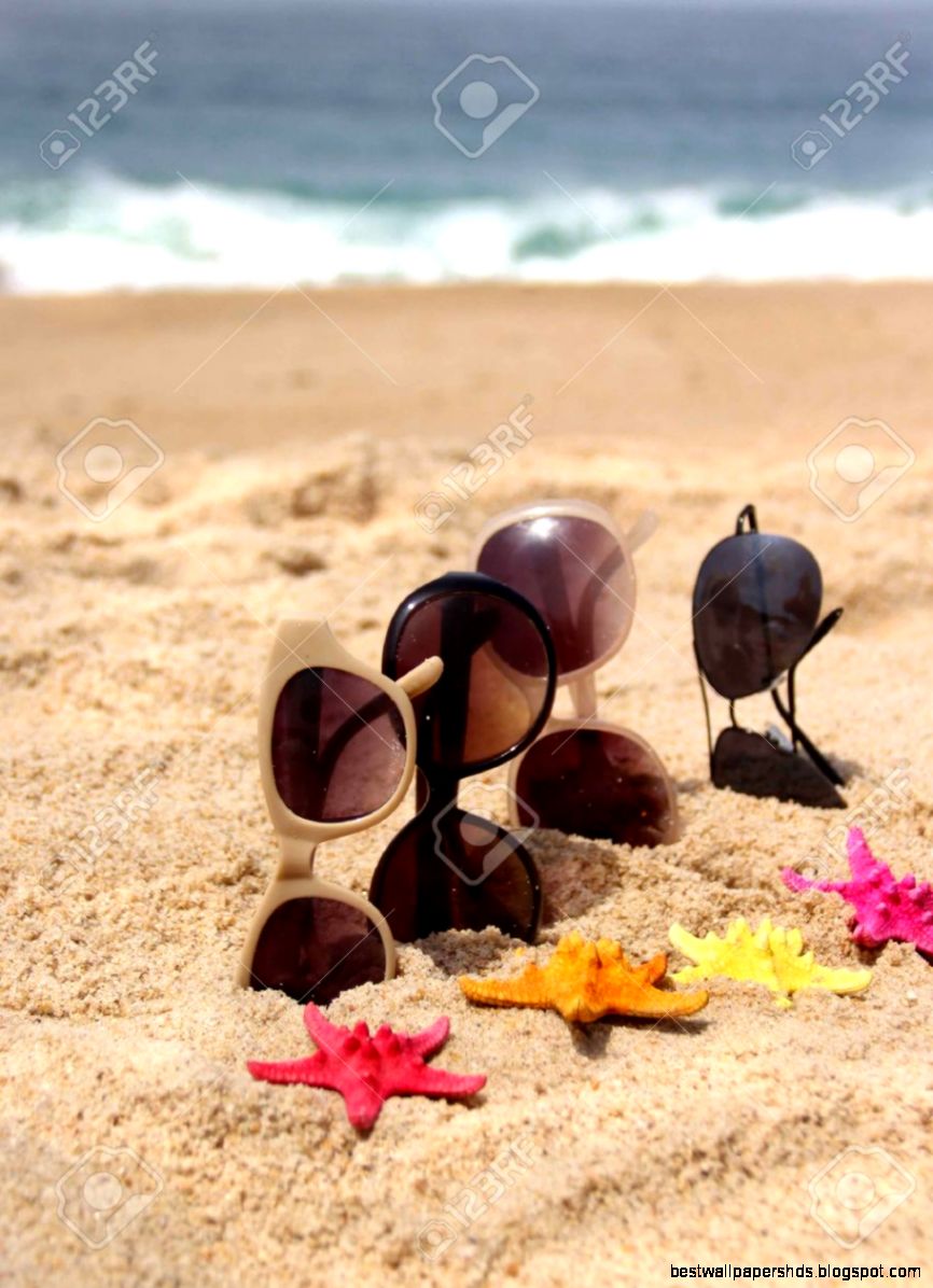 Family Holiday Four Pair Of Sunglasses On The Beach And Multi Family Holiday Four Pair Of Sunglasses On The Beach And Multi