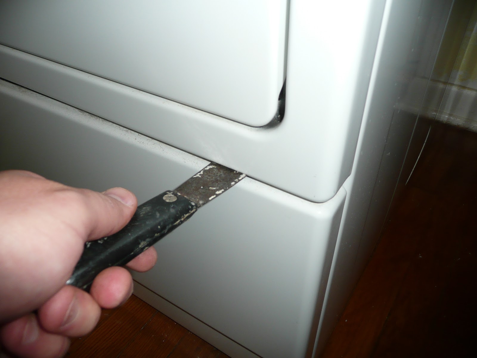 How do you remove the back of a Kenmore Series 90 dryer?