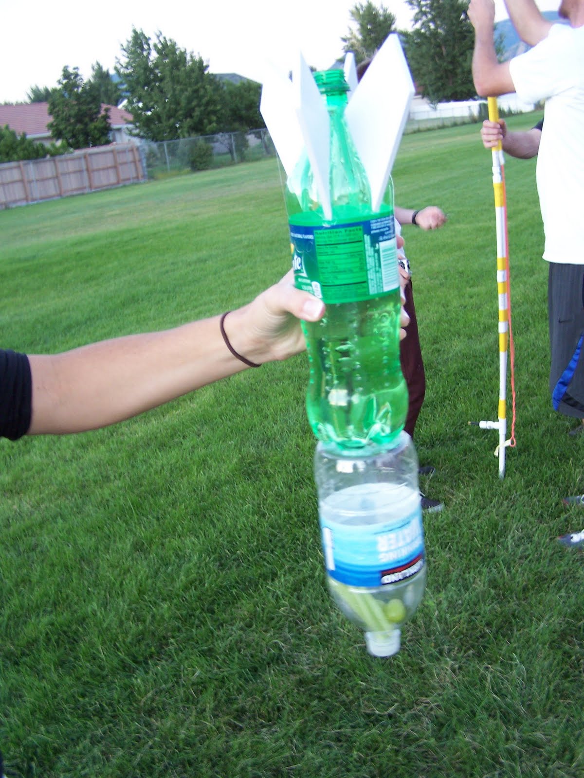 water bottle rockets Students are challenged to design and build rockets from two-liter plastic soda bottles that travel as far and straight as possible or stay aloft as long as possible. water bottle rockets Students are challenged to design and build rockets from two-liter plastic soda bottles that travel as far and straight as possible or stay aloft as long as possible.