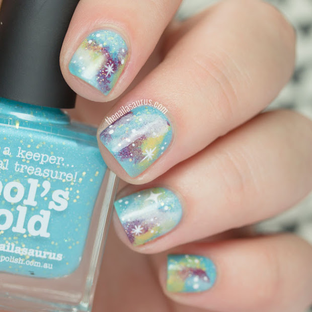 turquoise glittery galaxy nails
