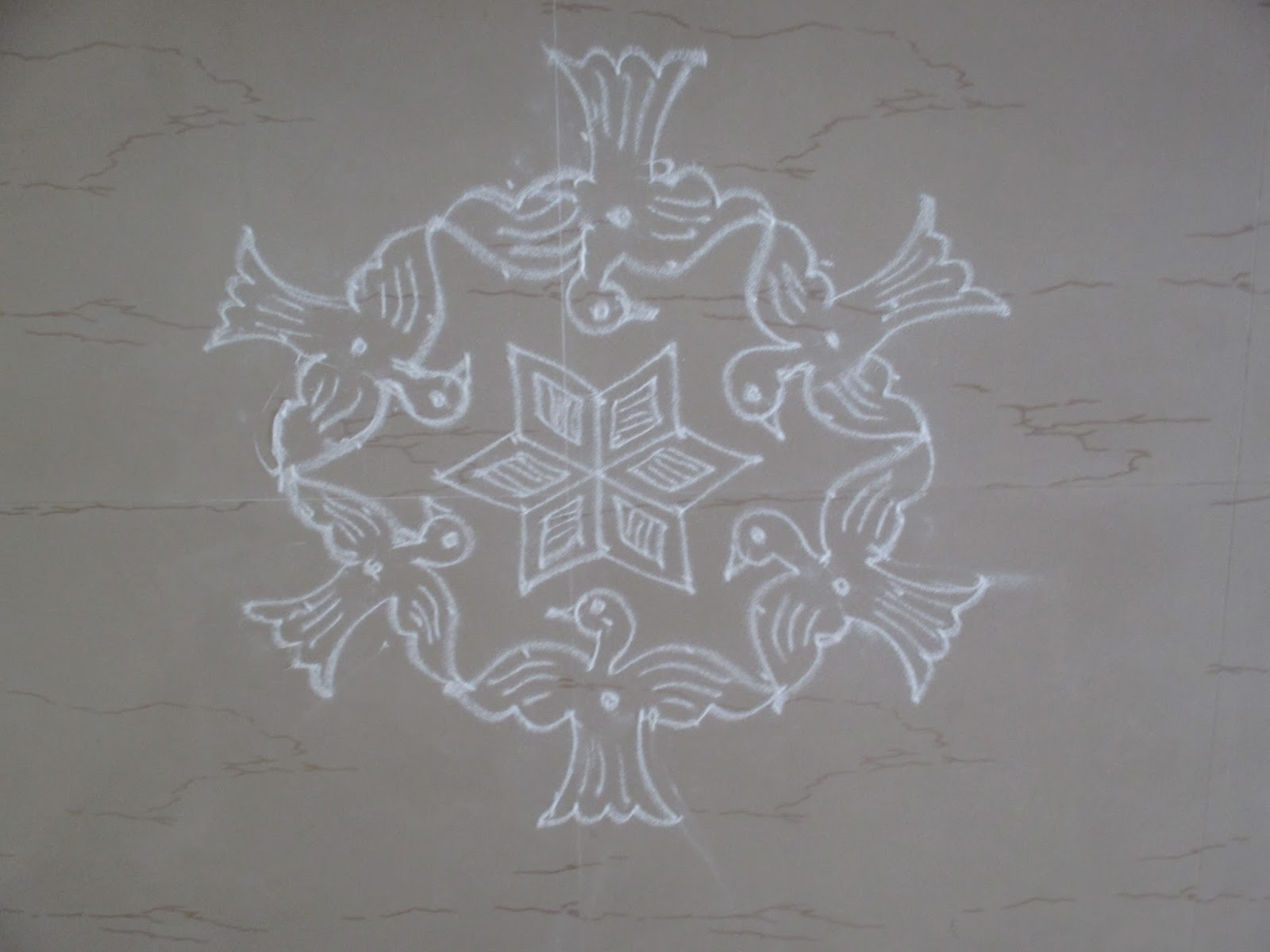 Bird kolam with dots