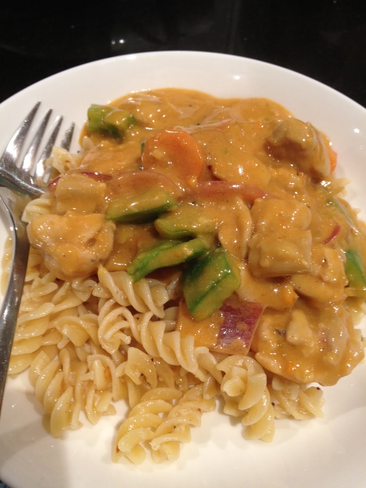 Daz in the Kitchen Satay chicken with garlic spiral pasta