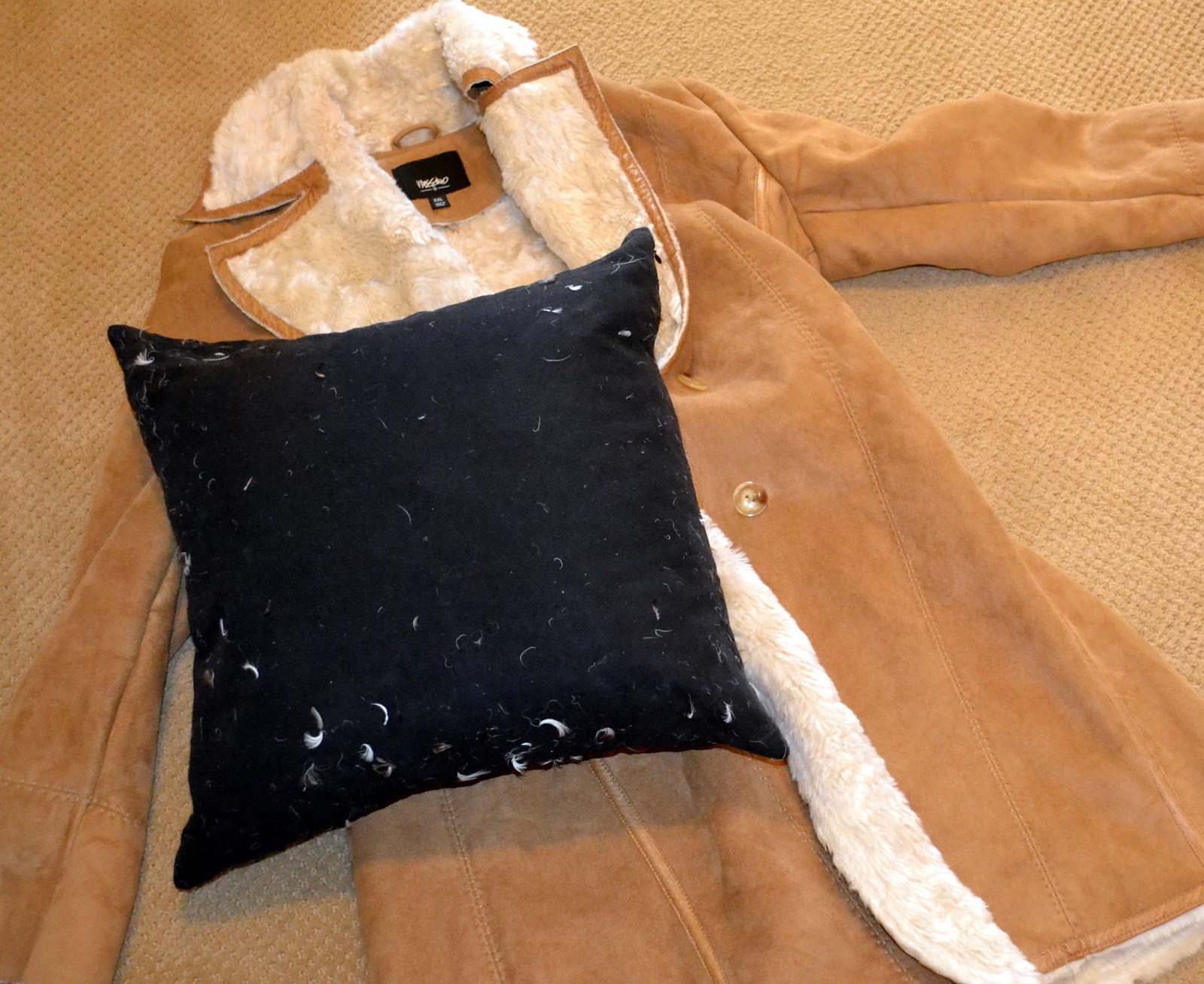 Leather coat turned into a pillow for around 2 Rachel Teodoro