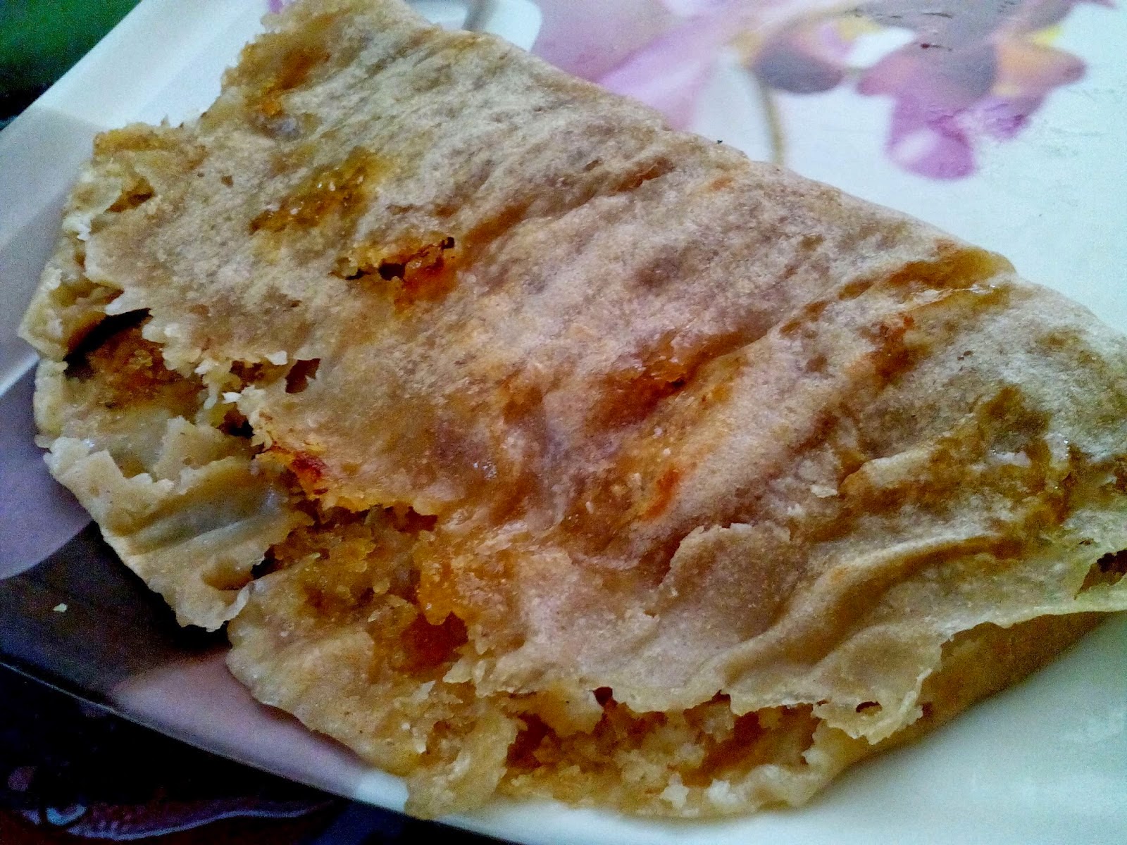 Ottada (Wheat pancake stuffed with coconut & jaggery and roasted