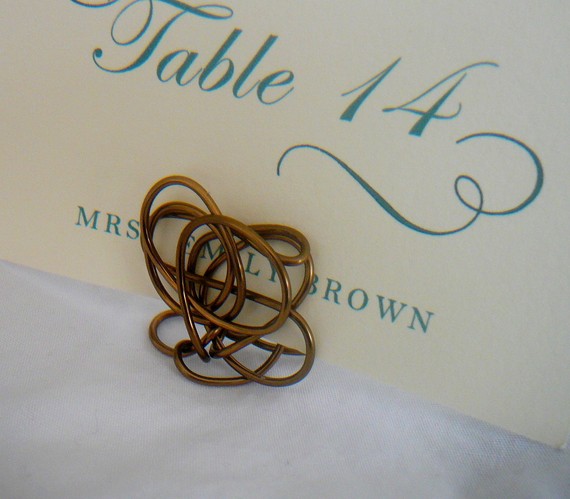 Homes and Weddings makes these twisty place card holders out of various Homes and Weddings makes these twisty place card holders out of various