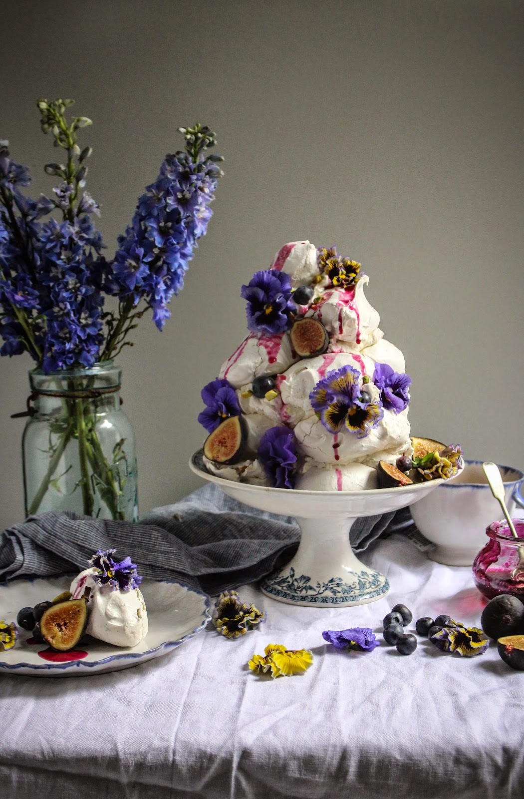 earl grey pistachio meringue tower with blueberries and figs and edible
