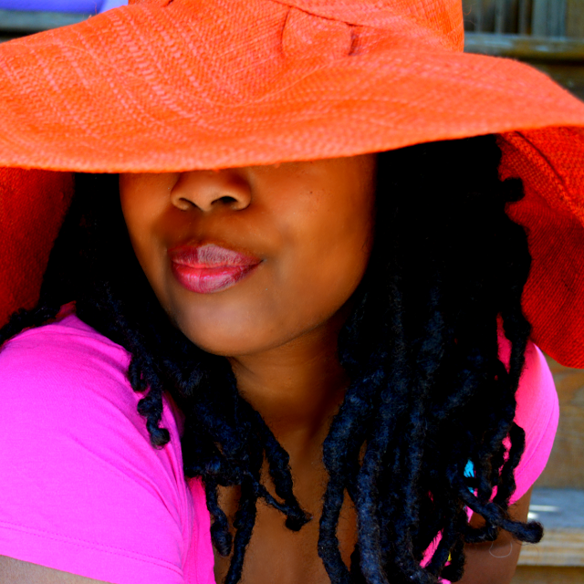 orange sunhat made in Kenya bought at a festival