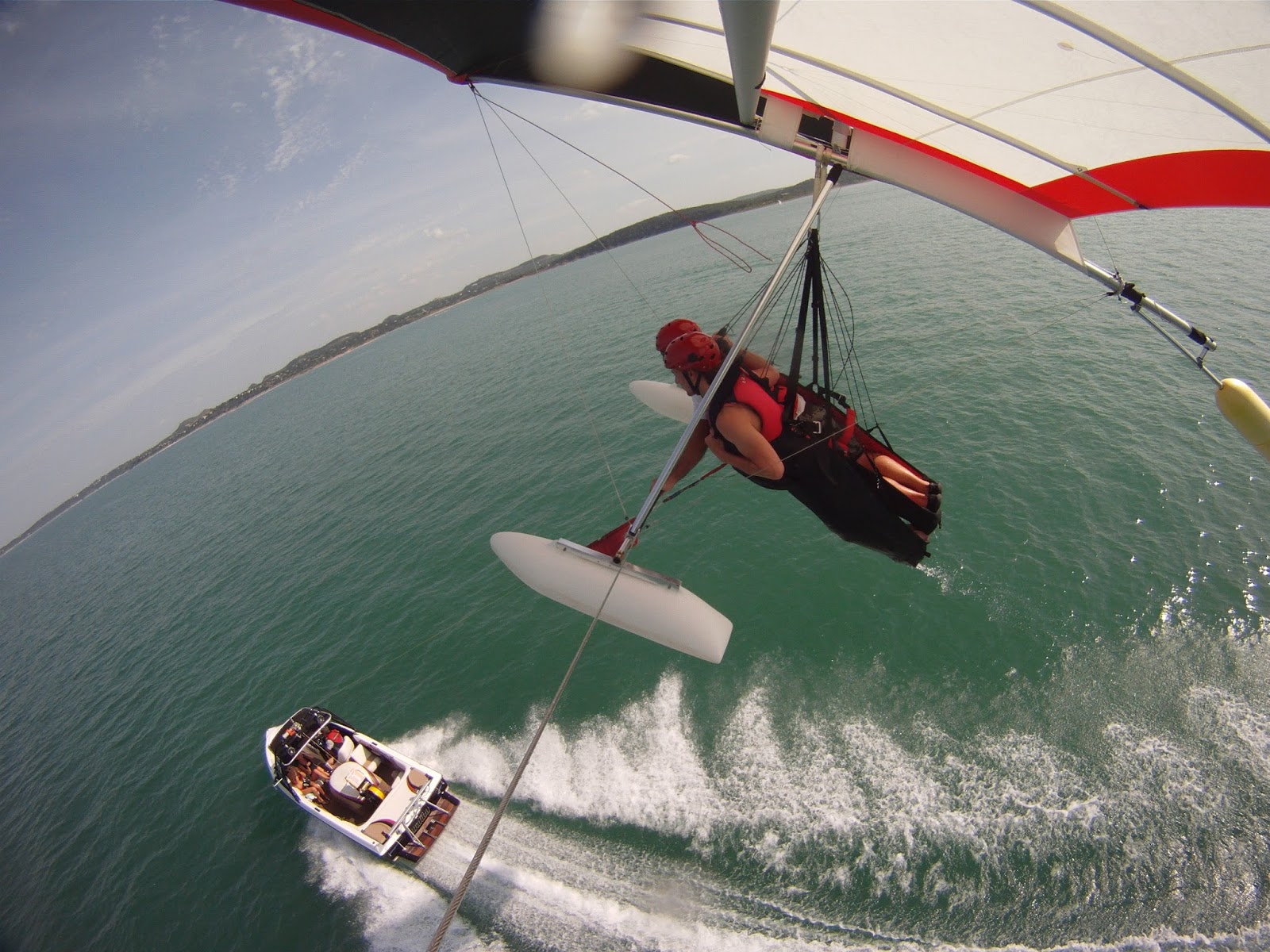 earth turns and wind burns Hang gliding behind a boat on Canyon Lake