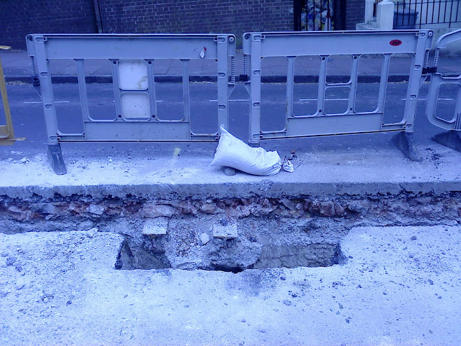 Tram rails in Queens park Road, reused as track supports.