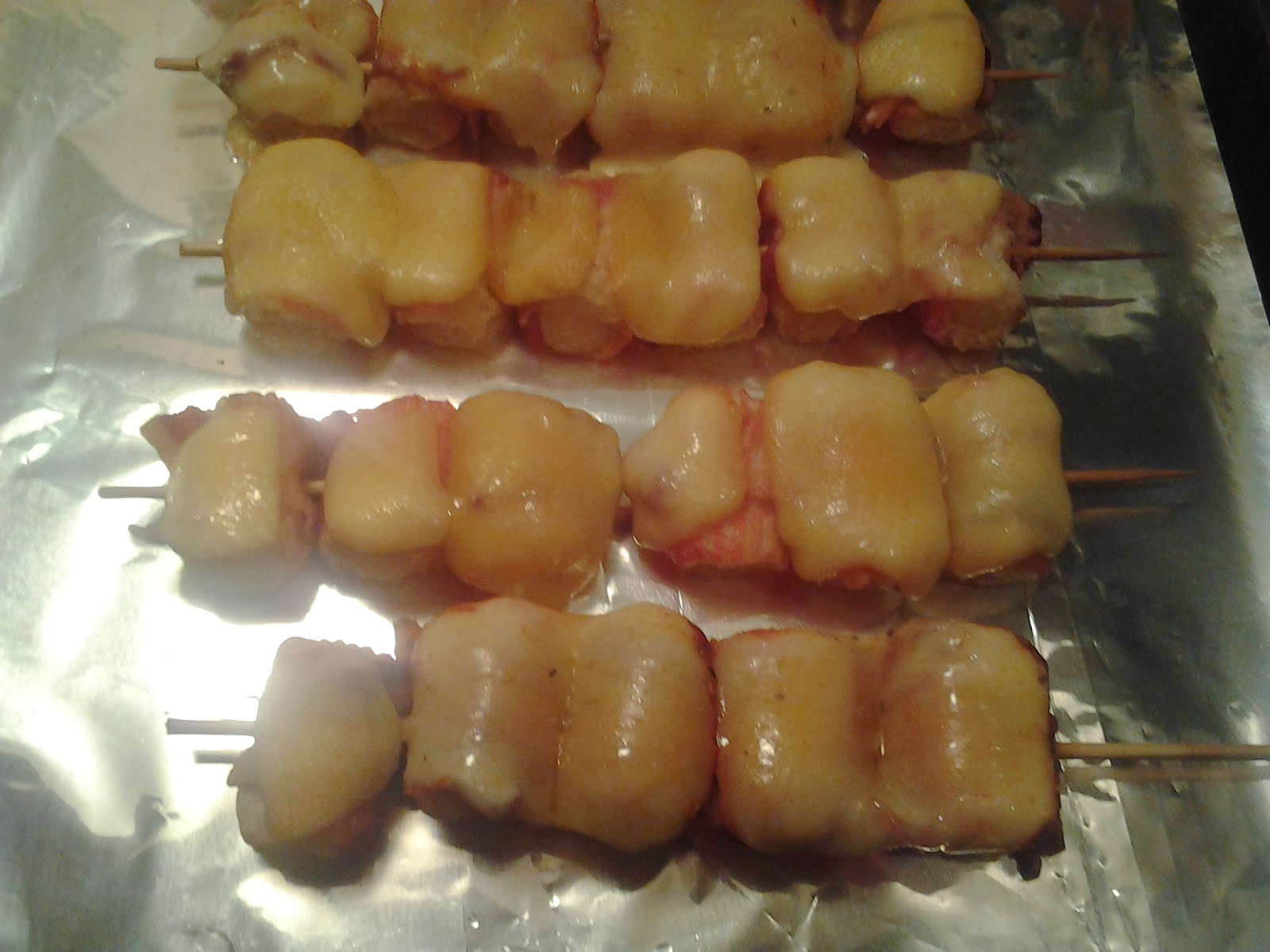 Chow Daddy Bacon Wrapped Fake Crab Legs Topped With Smoked Gouda