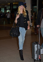 Very easy, but it's casual fashion trend as the Supermodel, Bridget Malcolm, 23, appeared wearing a navy jeans, worn with a huge hat, and stuffed a dark blazer at the airport in Sydney, Australia on Sunday, December 20, 2015.