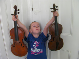 boy with decrepit violins