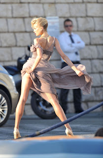 Karolina Kurkova stiking a pose in a flowing gown
