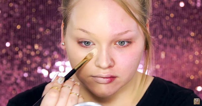 Woman Demonstrates The Power Of Makeup