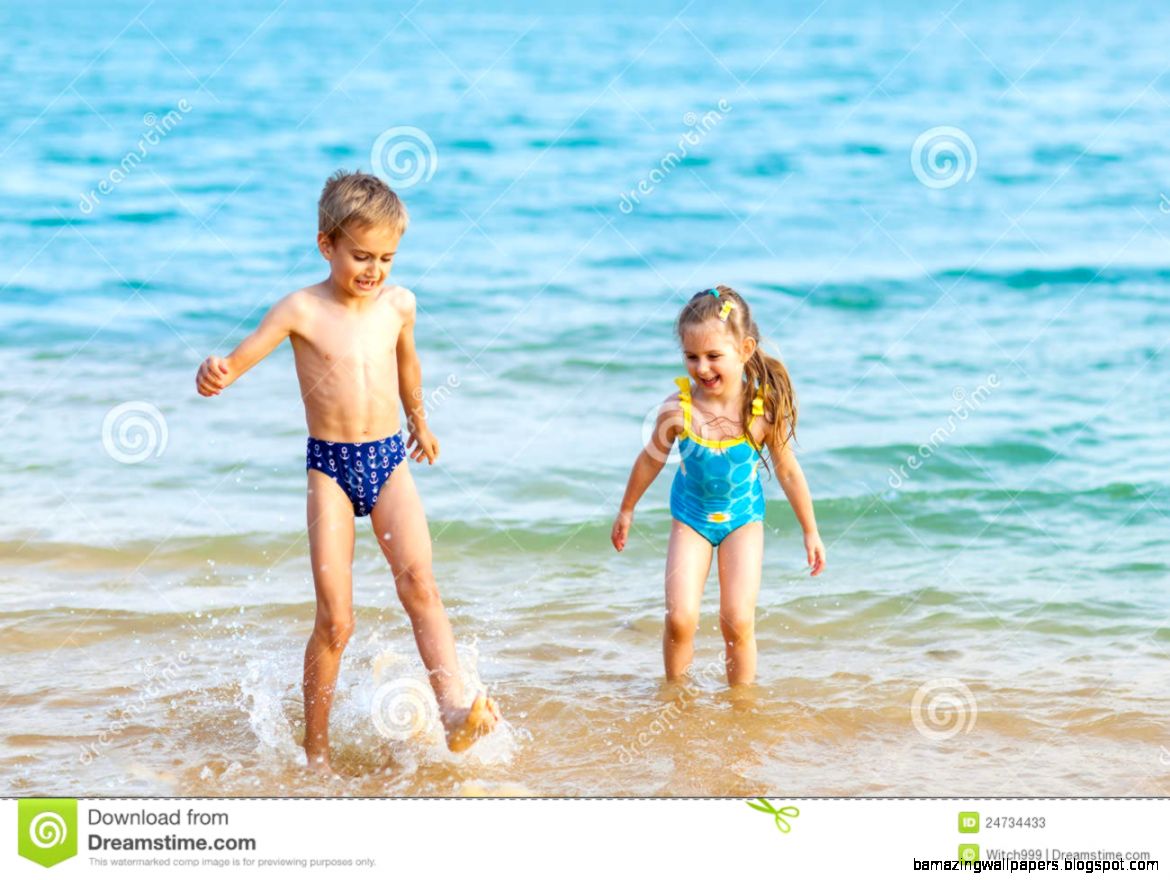 Happy Kids Playing At The Beach Shore Stock Photos Image 24734433 Happy Kids Playing At The Beach Shore Stock Photos Image 24734433
