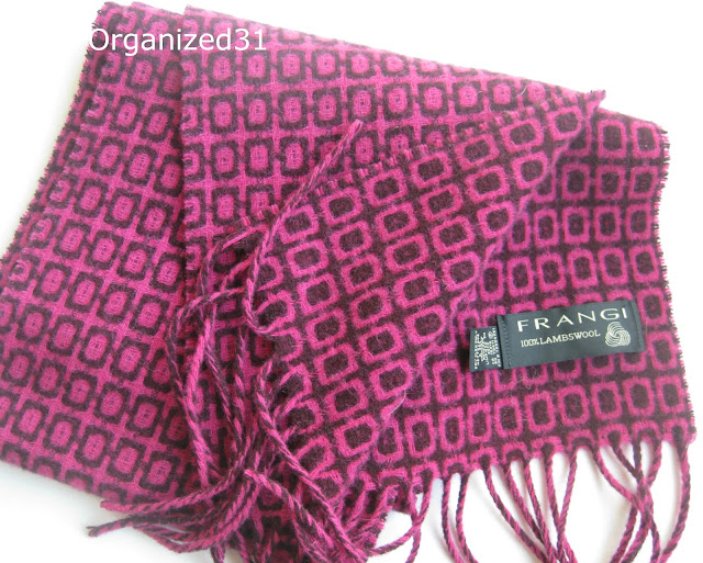 pink and maroon scarf on white table