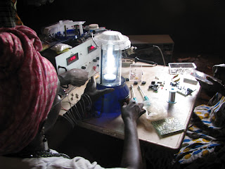Fatima Seidi finishing solar lanterns in Mambonko