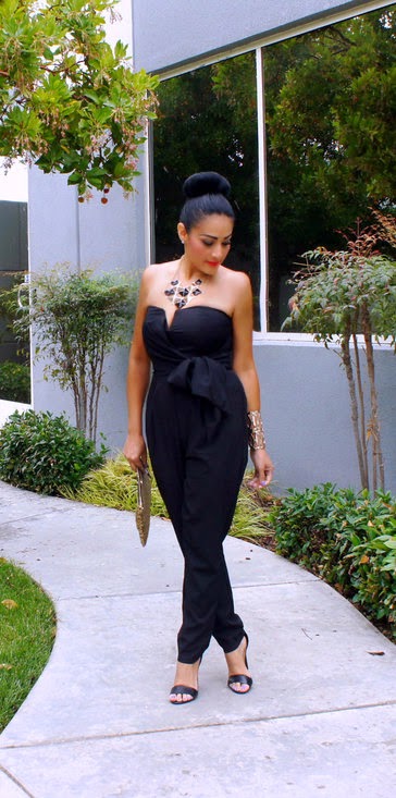 black jumpsuit with gold accessories