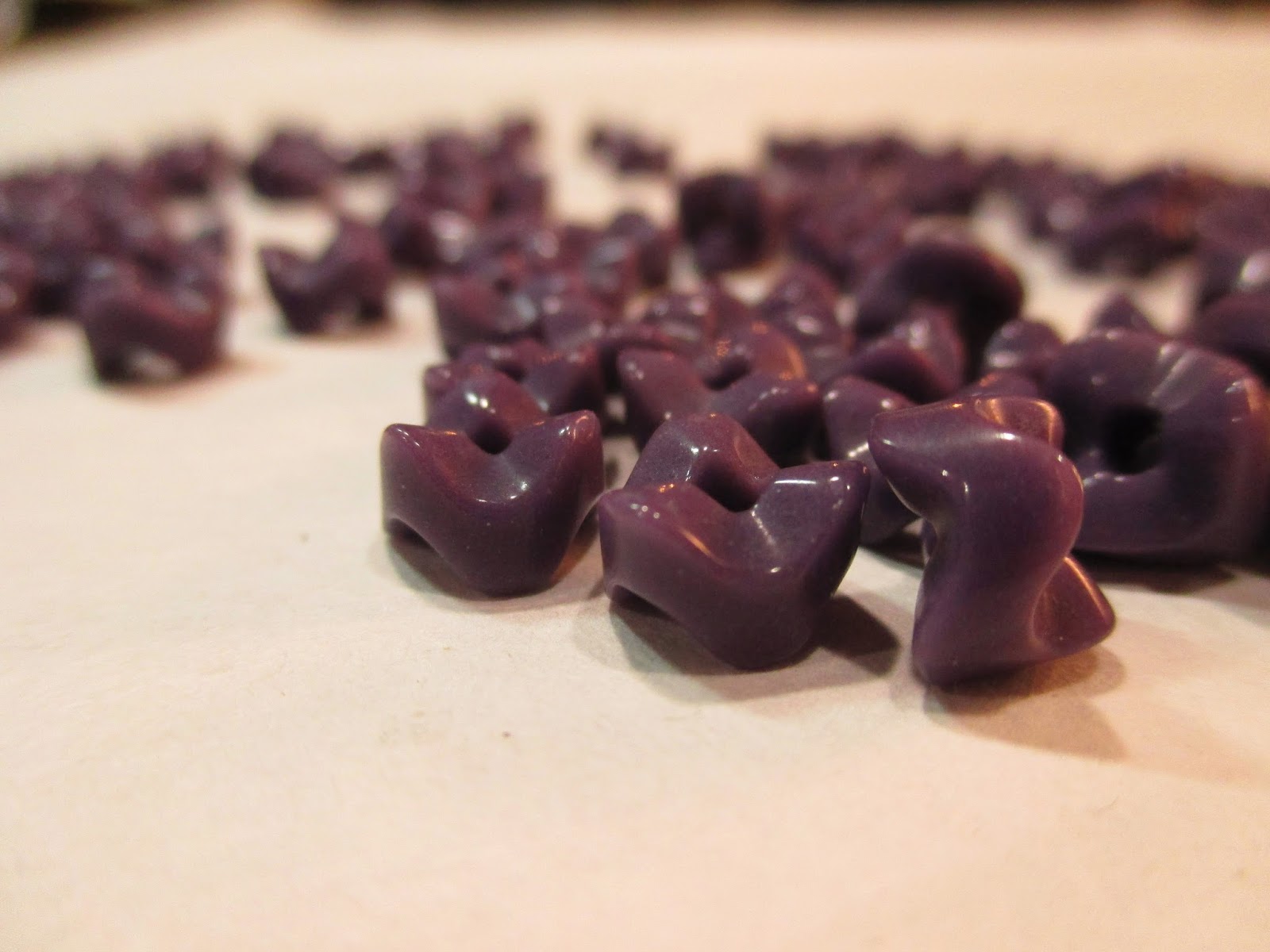 Purple glass vertebrae beads.