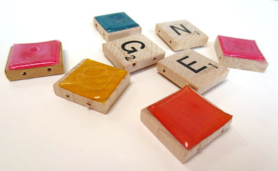 Scrabble tiles covered with colored plastic