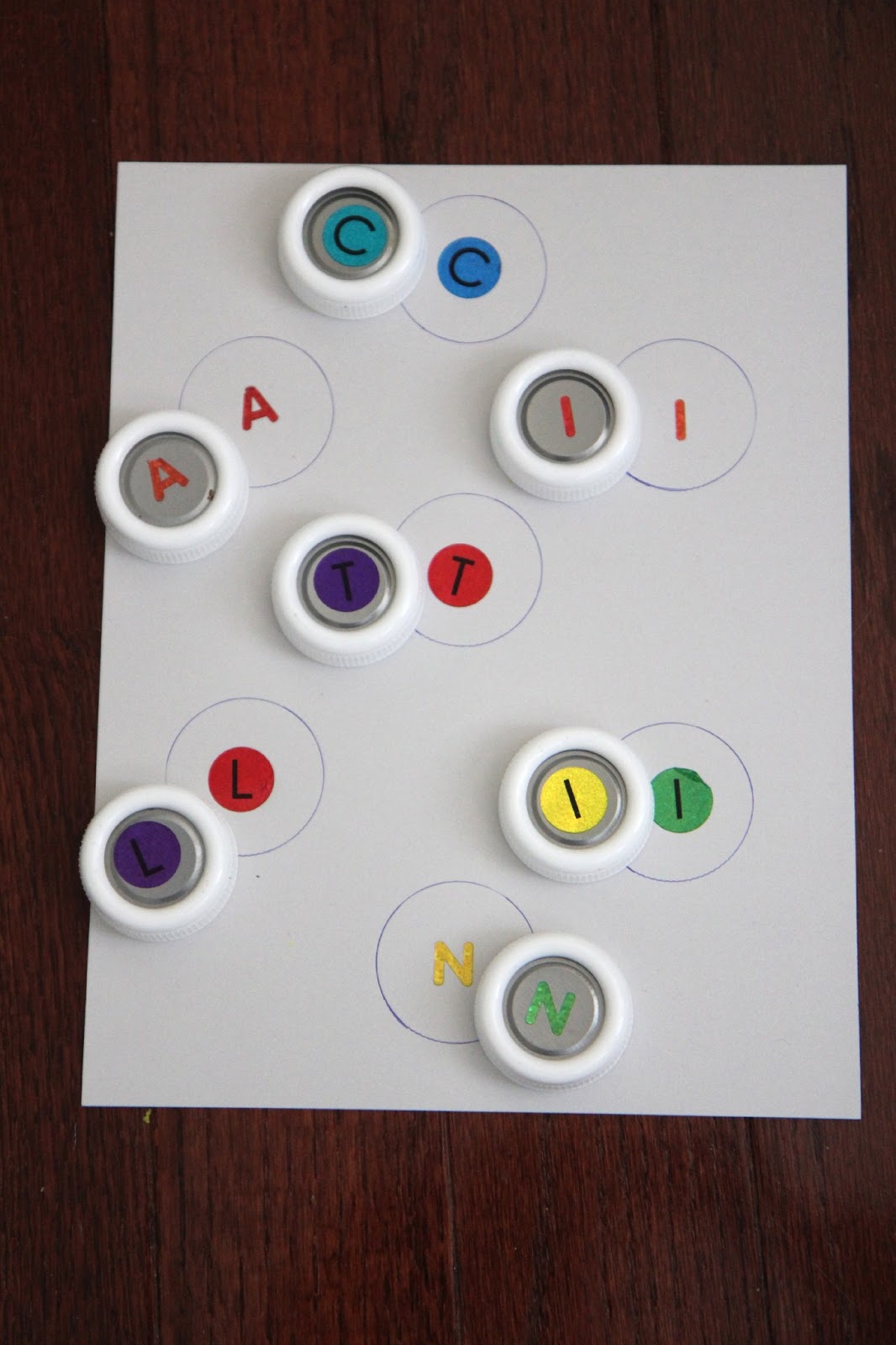 Toddler Approved! Little Learners Bottle Cap Name Matching
