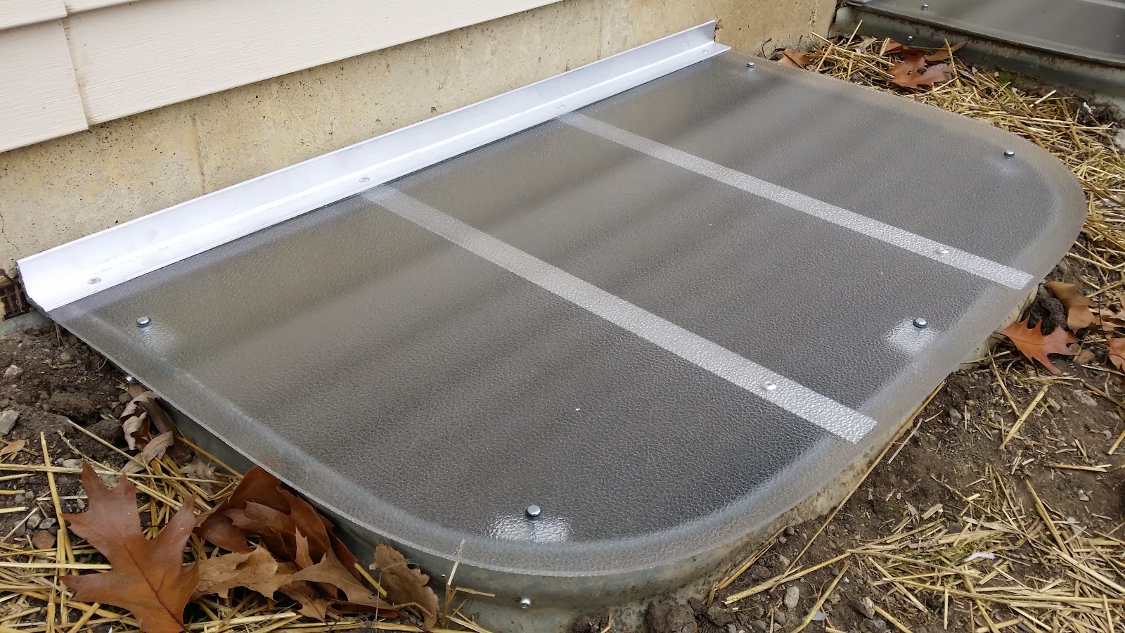 window well covers basement windows types materials coverings metal options lexan installation diy walls egress water glass exterior ge votebyissue