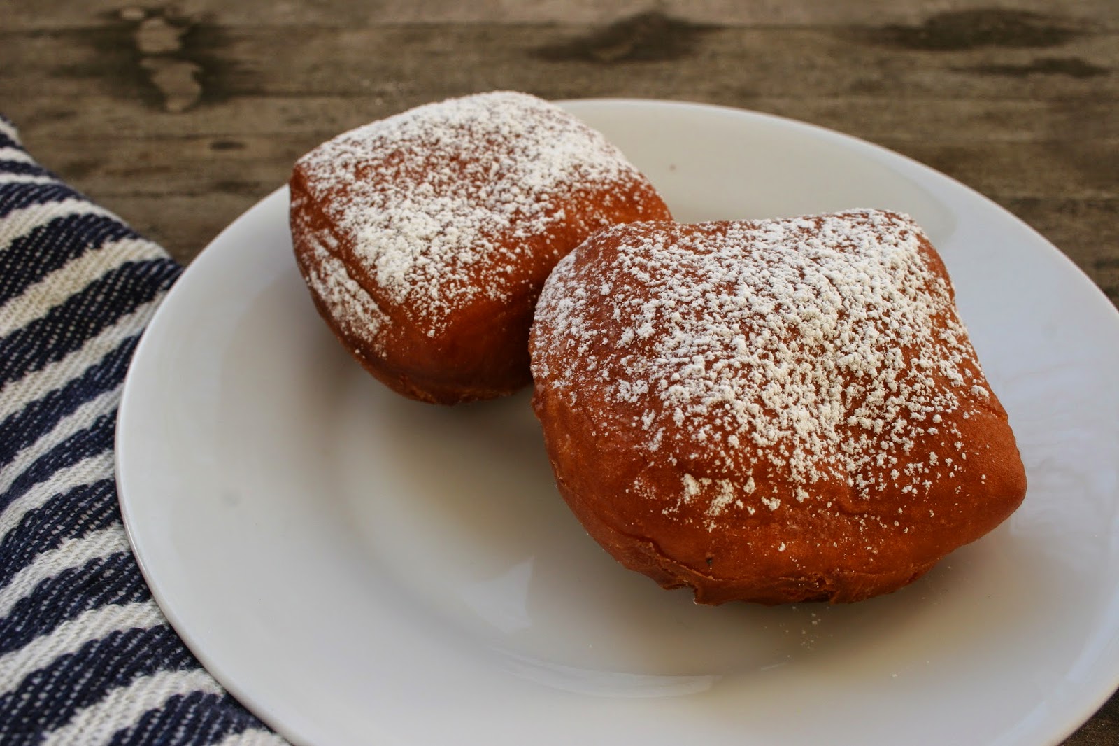 Homemade Beignets with Powdered Sugar on plate