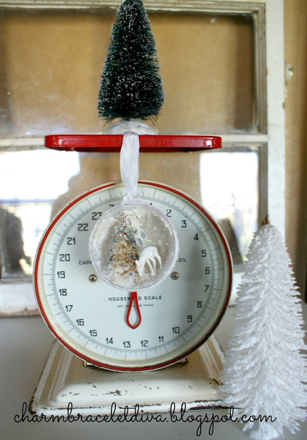 Christmas vignette with ornament, bottle brush tree and scale vignette - featured at KnickofTime.net