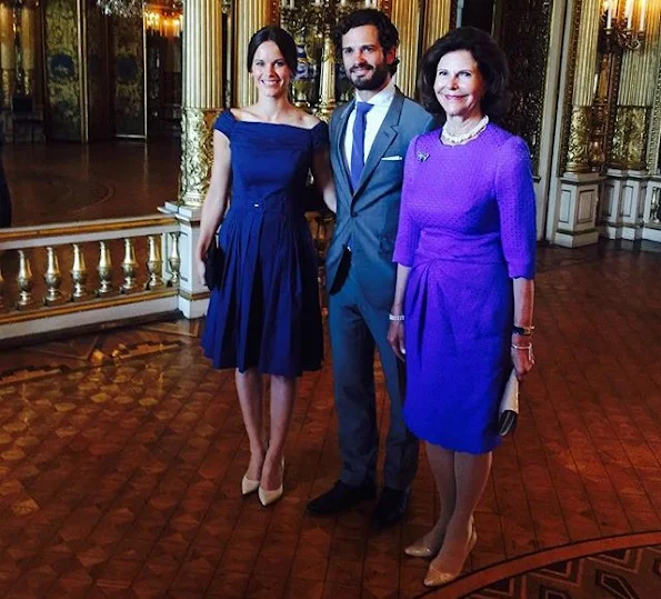 Queen Silvia of Sweden, Prince Carl Philip and Princess Sofia of Sweden at the inauguration of "The Lilian Look" exhibition. The exhibition Designs for a Princess – The Lilian Look! will be on display at the Royal Palace of Stockholm.