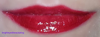 Lime Crime Candy Apple Carousel Gloss over Opaque Lipstick in Glamour 101
