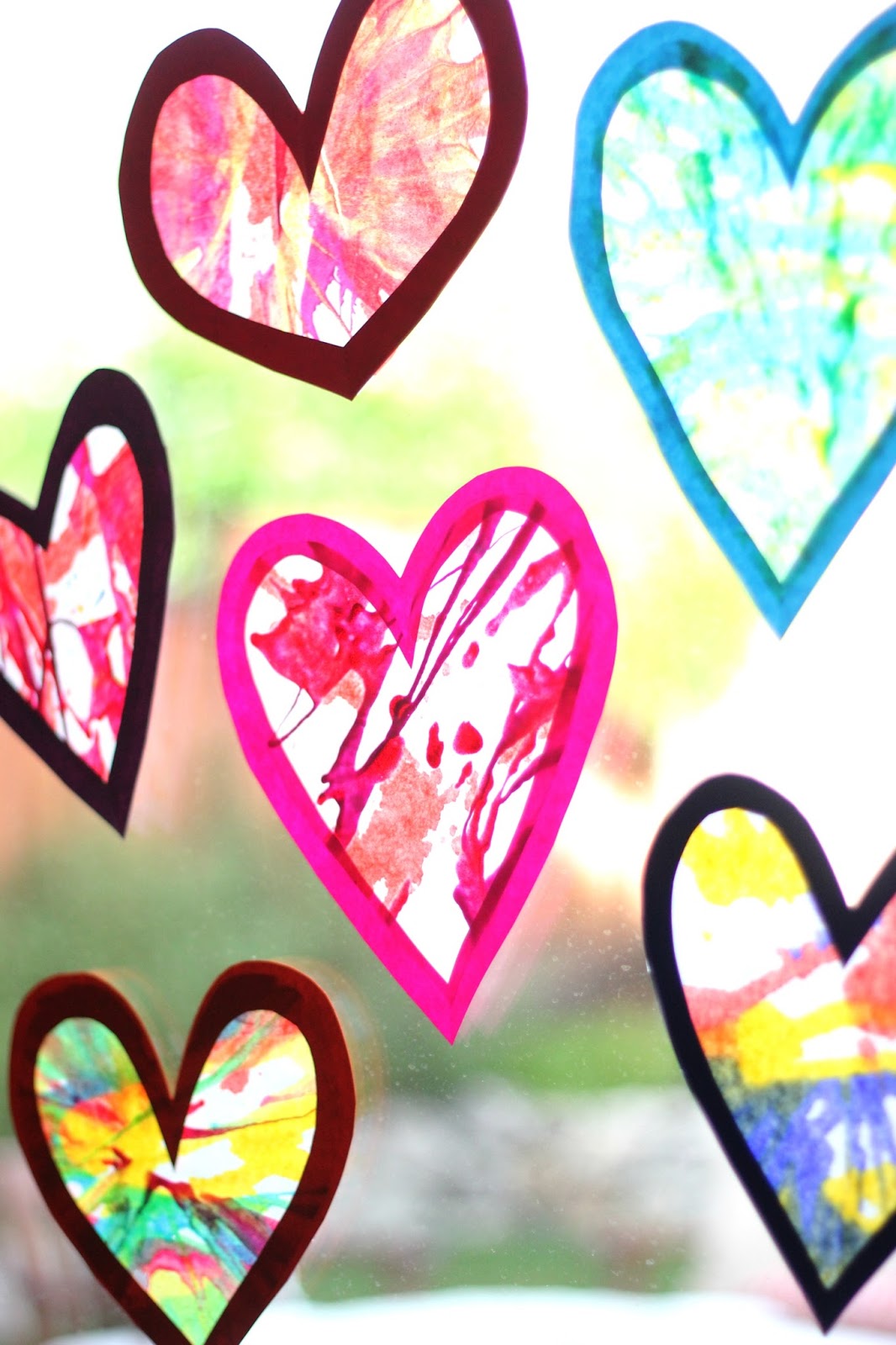 toddler approved spin art heart suncatchers