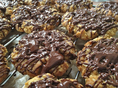 Oaty biscuits drizzled with warm chocolate