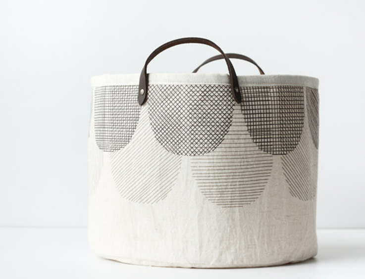 pale fabric basket with leather handles