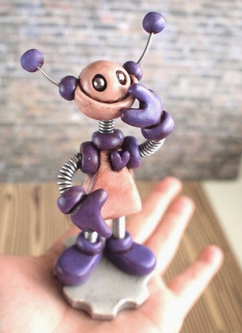 13-Purple-Pat-Grungy-Bot-HerArtSheLoves-Clay-Robot-World-Sculptures-www-designstack-co