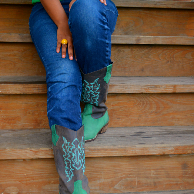 jeans worn with green cowboy boots