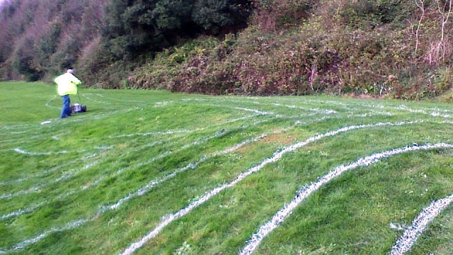 Ventnor Enhancement Fund Labyrinth marked out in white paint in the shape of a dinosaur