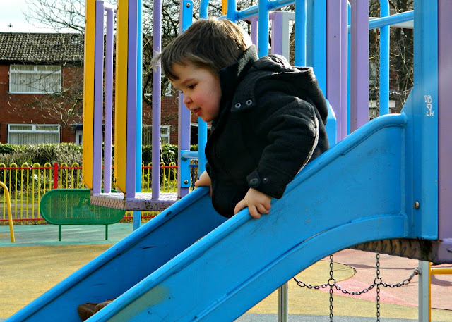 Small boy toddler slide playground