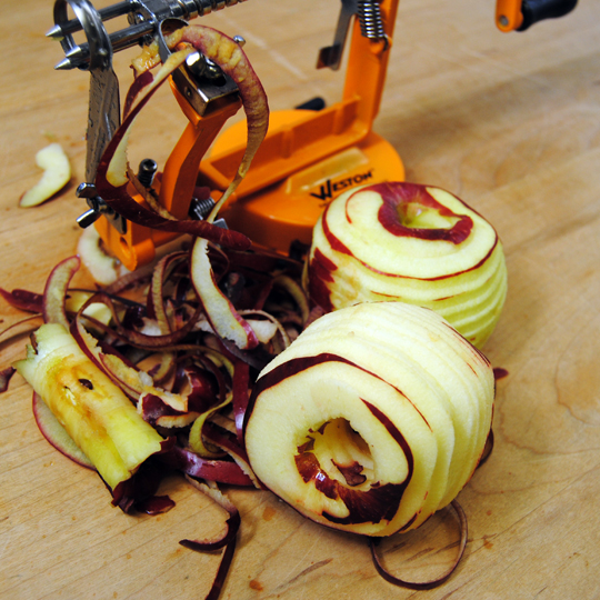 Place the apples onto foil and fill the hollow middle with the cheddar