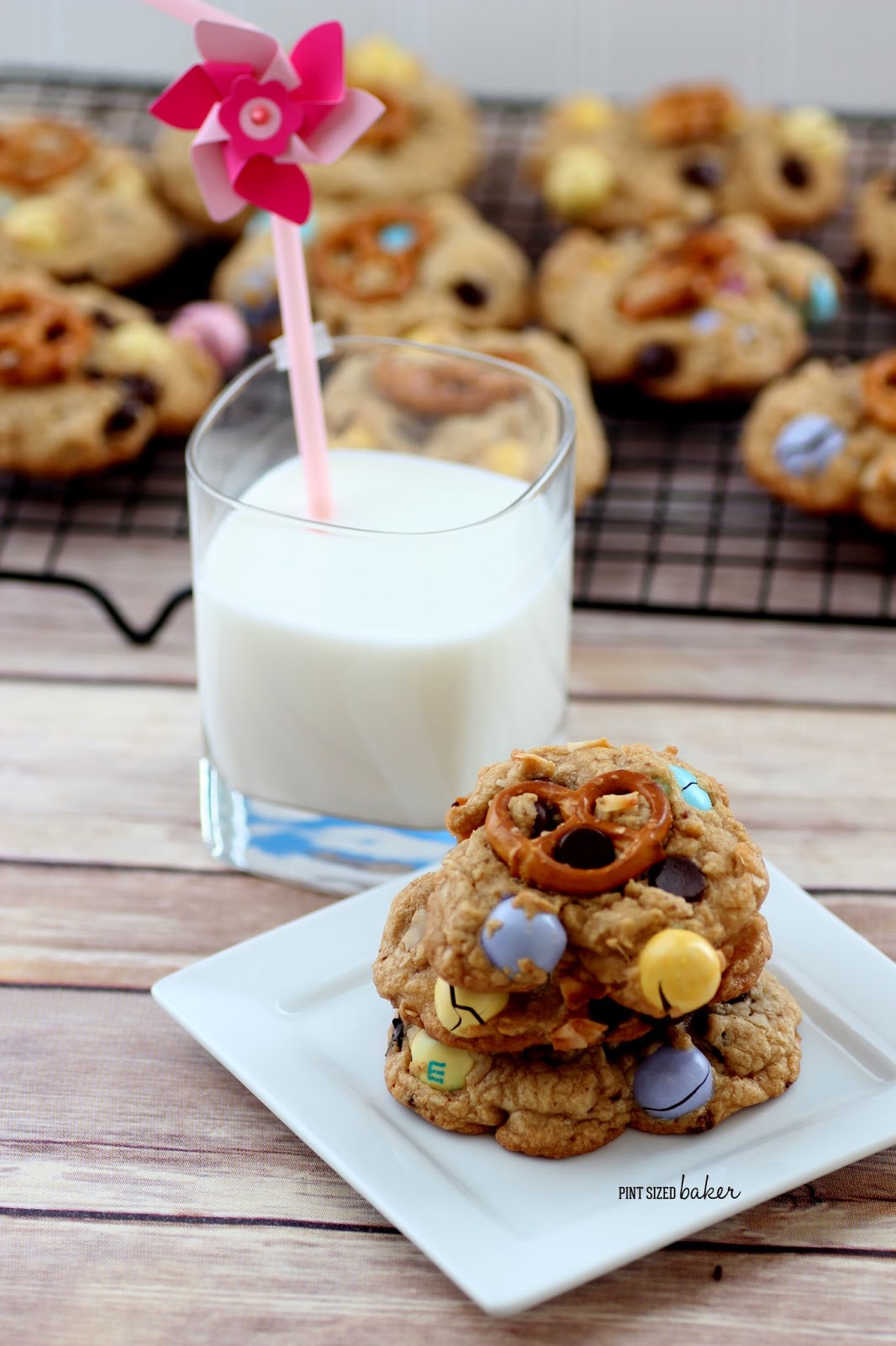 Love sweet and salty? You're gonna love these M and M Pretzel Chocolate Chip Cookies! Easy cookies with salty pretzel M&M's and a pretzel on top!