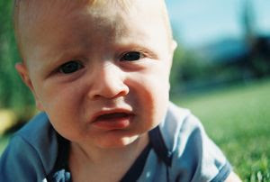 Unhappy Baby. Stock Photo credit: etrnl